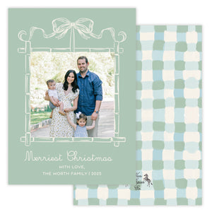 Christmas card with a family photo and checkered pattern on a green background