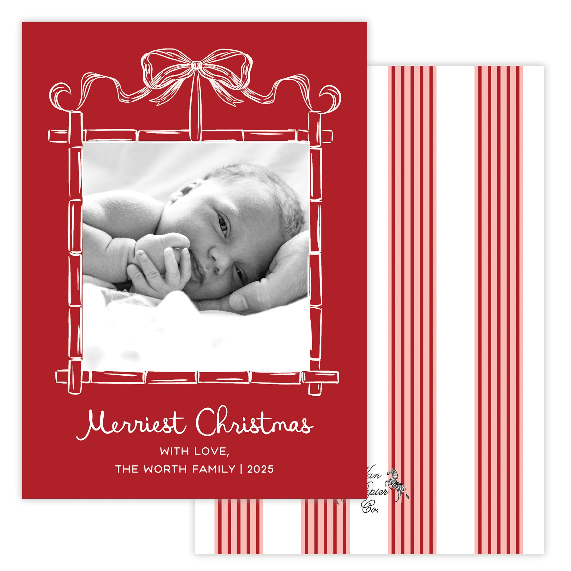 Christmas card with a baby photo and red bamboo border featuring a bow.