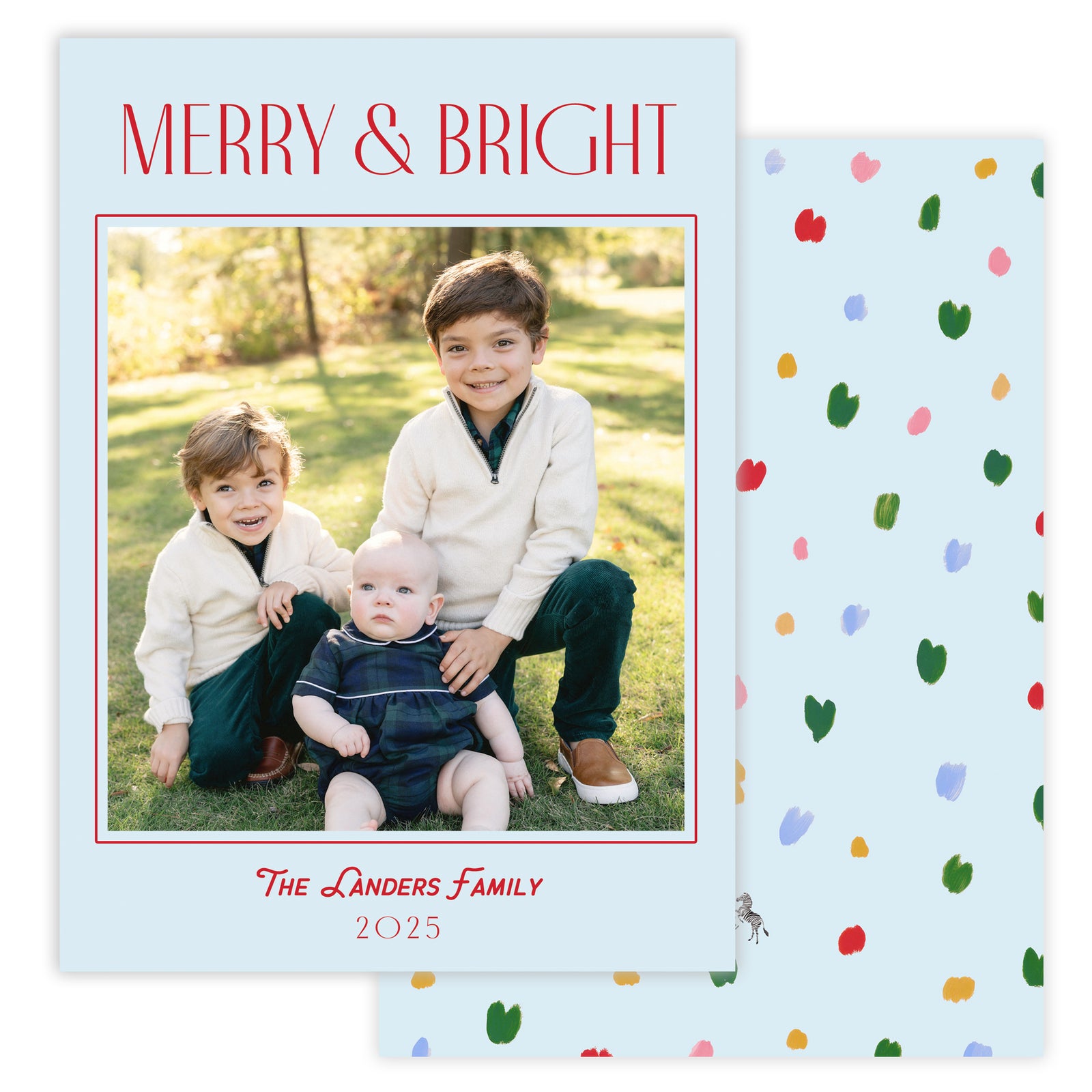 Christmas card photo with merry and bright text and blue background.
