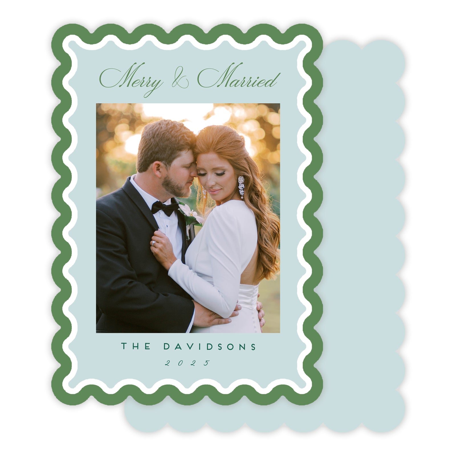 Greeting card with a couple embracing, text 'Merry & Married' on a light blue background.
