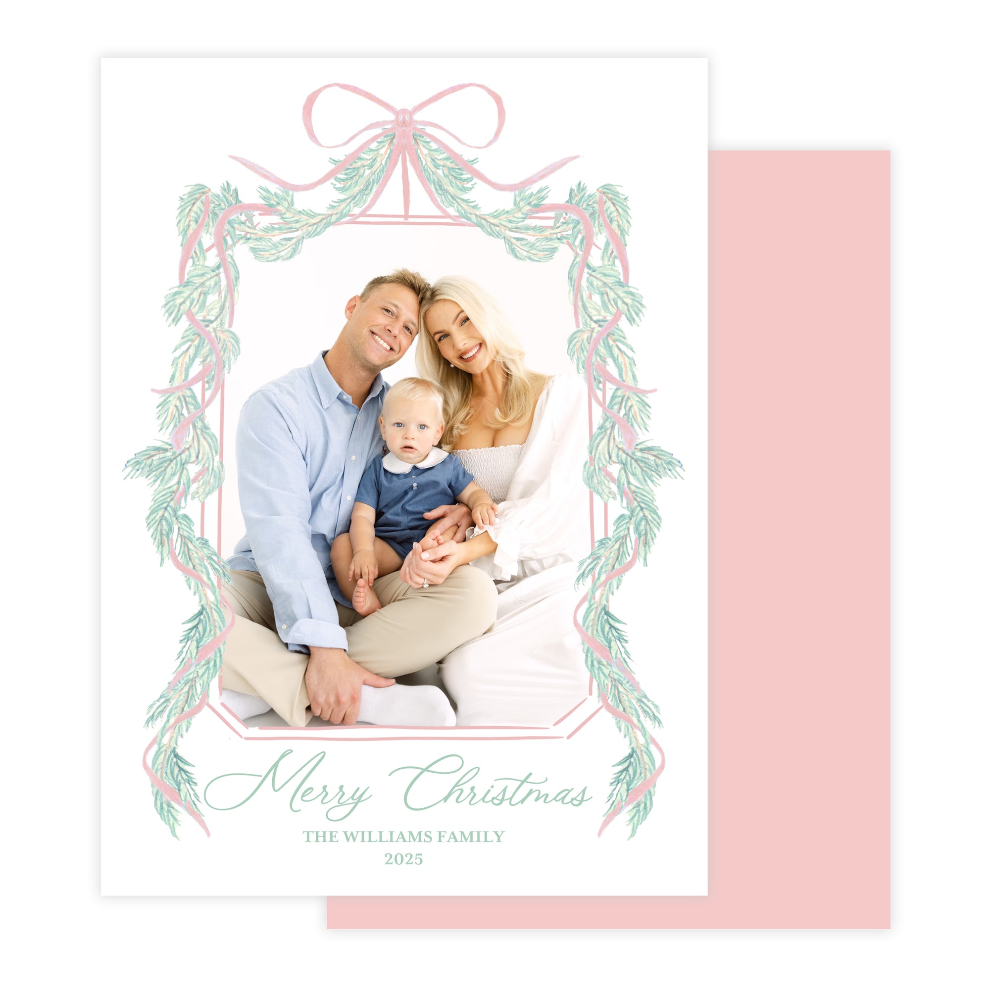 Christmas card with a family photo and decorative garland border.