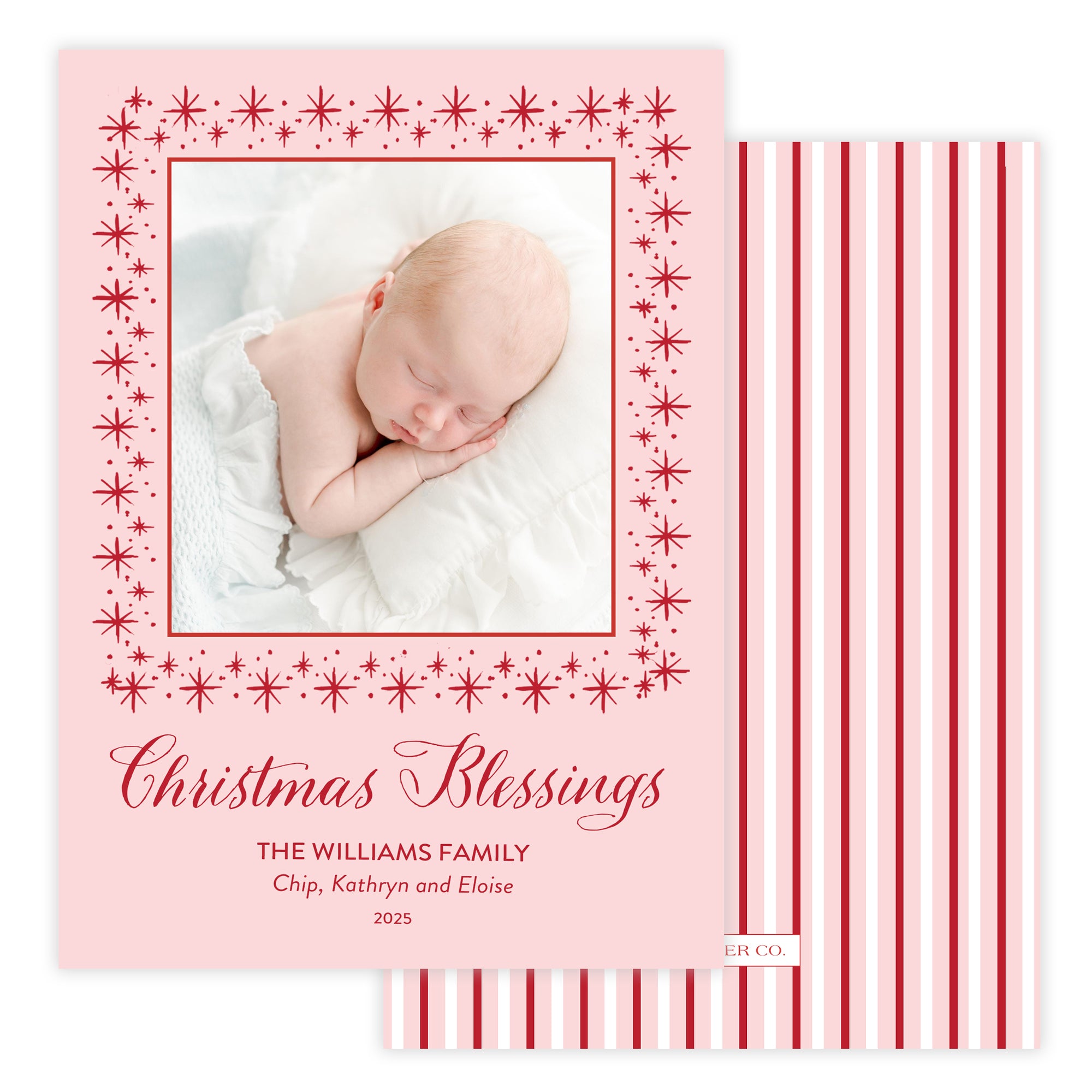 Christmas card with a baby photo and 'Christmas Blessings' text on a pink background with red stripes.