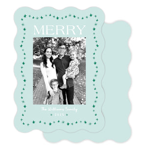 Christmas card with a family photo and 'Merry' text on a light blue background