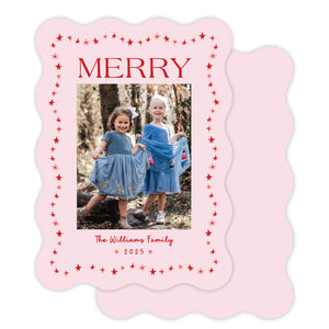 Christmas card with two children in blue dresses and 'Merry' text on a wavy die cut pink border.