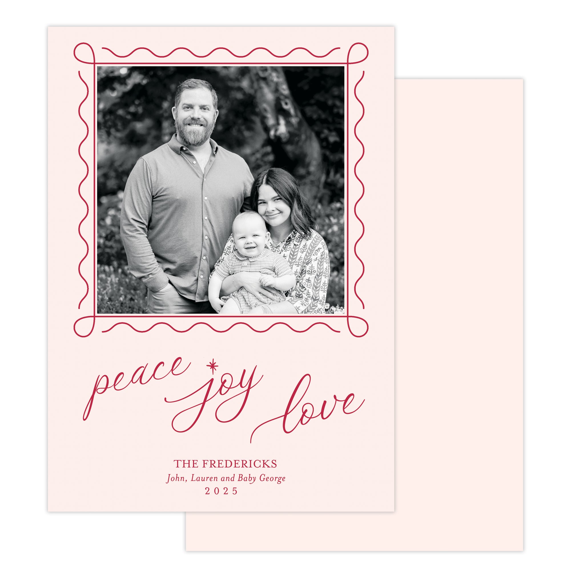 Holiday card with family photo and 'peace joy love' text on a pink background